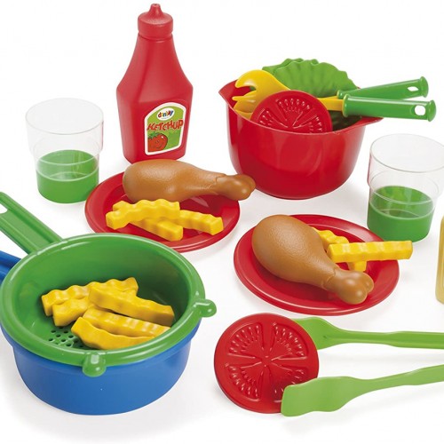 A set of dishes and products (chicken legs, fries and vegetables) for lunch