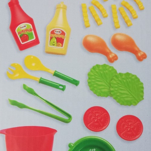 A set of dishes and products (chicken legs, fries and vegetables) for lunch